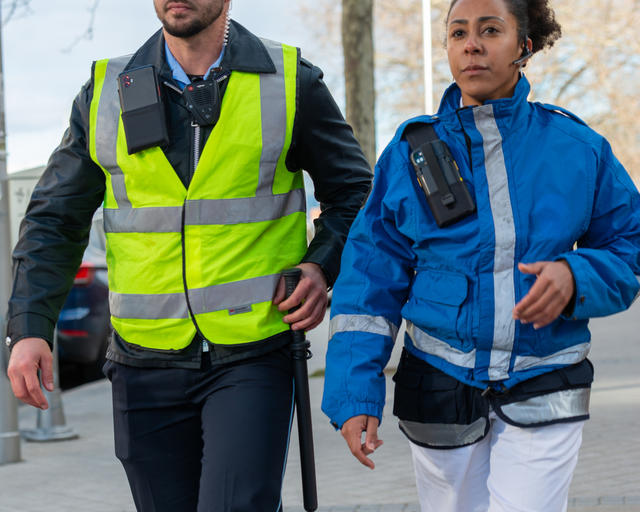 Paramedic and security guard walking Paramedic and security guard walking